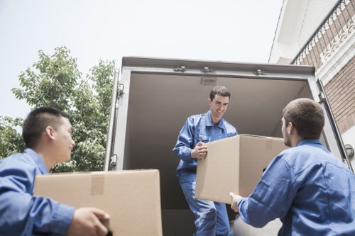 Packed boxes and furniture ready for a Crewshill house removal