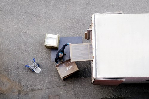 Crew using protective equipment while moving furniture