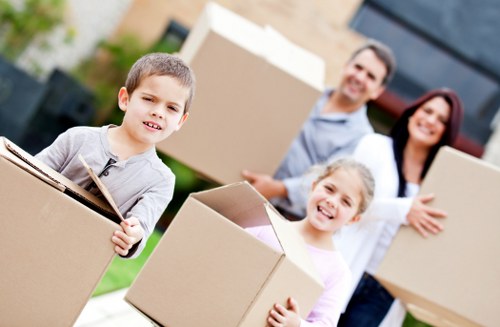Loading household boxes and furniture into a removal van in Crewshill