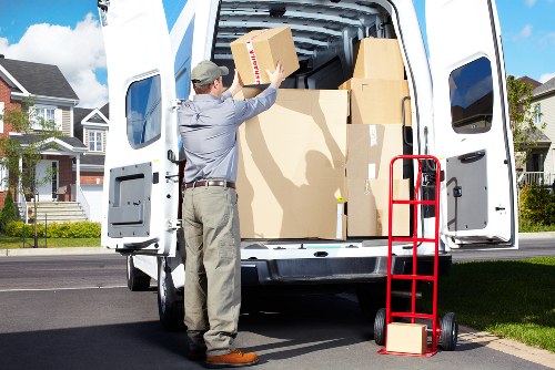Professional movers handling furniture on moving day in Crewshill