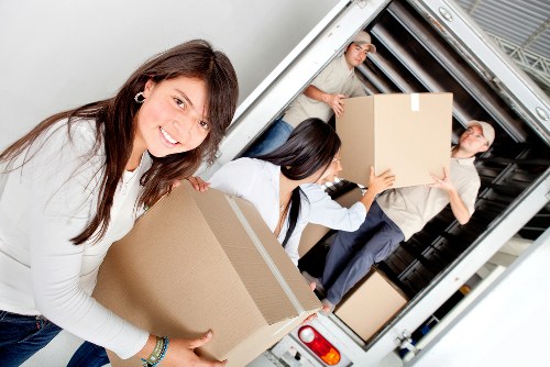 Packing and loading household items into a removal van