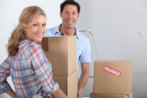 Local moving team handling boxes and household items in Crewshill